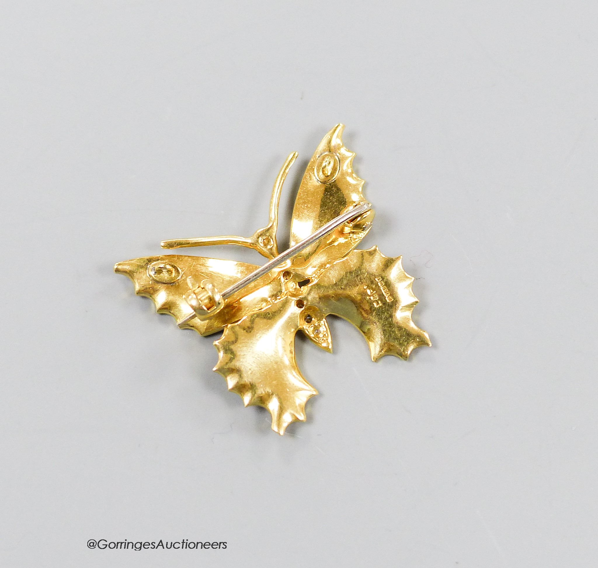 A modern 18ct gold, blue enamel and diamond set butterfly brooch, 22mm, gross weight 5.7 grams.